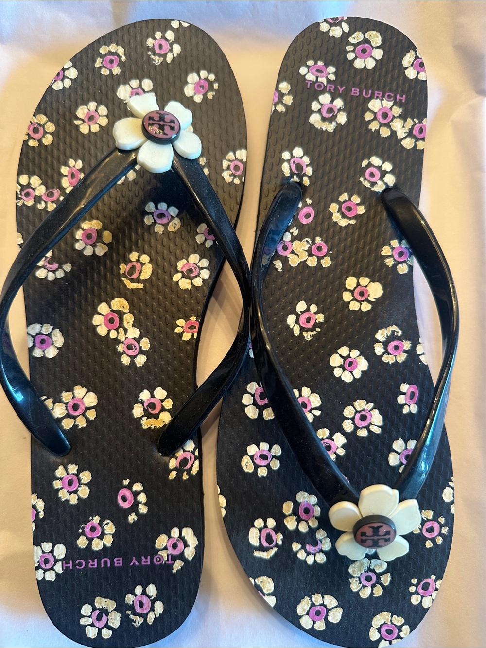 Tory Burch Black Floral Flip Flops with Cream Daisy Charm